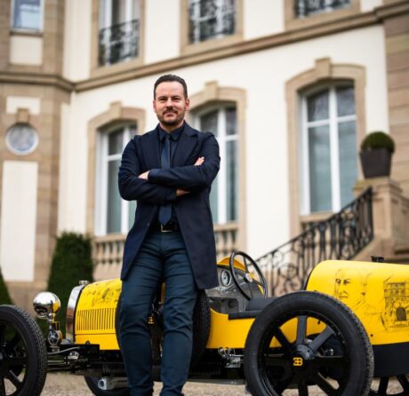 Jascha Straub standing next to the Bugatti Baby II