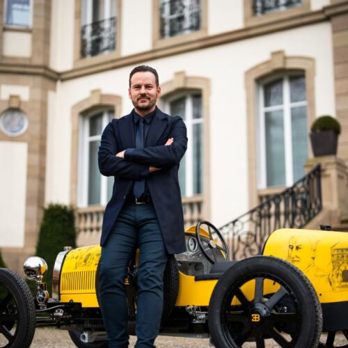 Jascha Straub standing next to the Bugatti Baby II