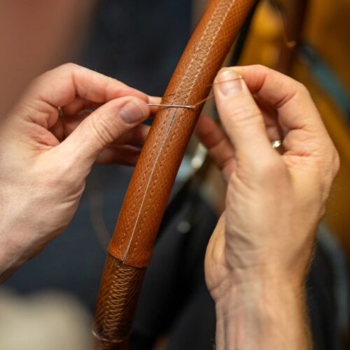 The George Cleverly steering wheel being hand sewn